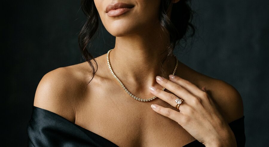 Diamond tennis necklace and oval solitaire, worn